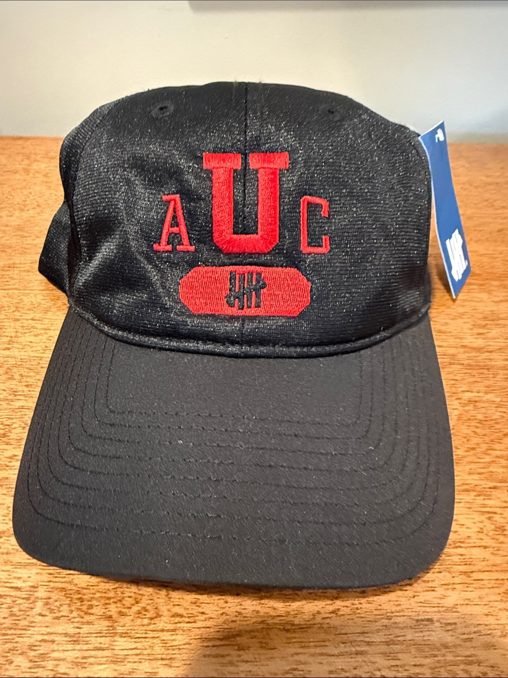 Undefeated Black Cap with Blue Hang Tag